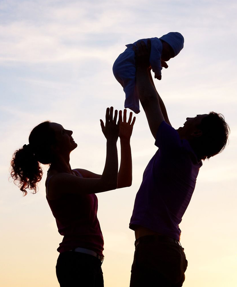 Family holding their child
